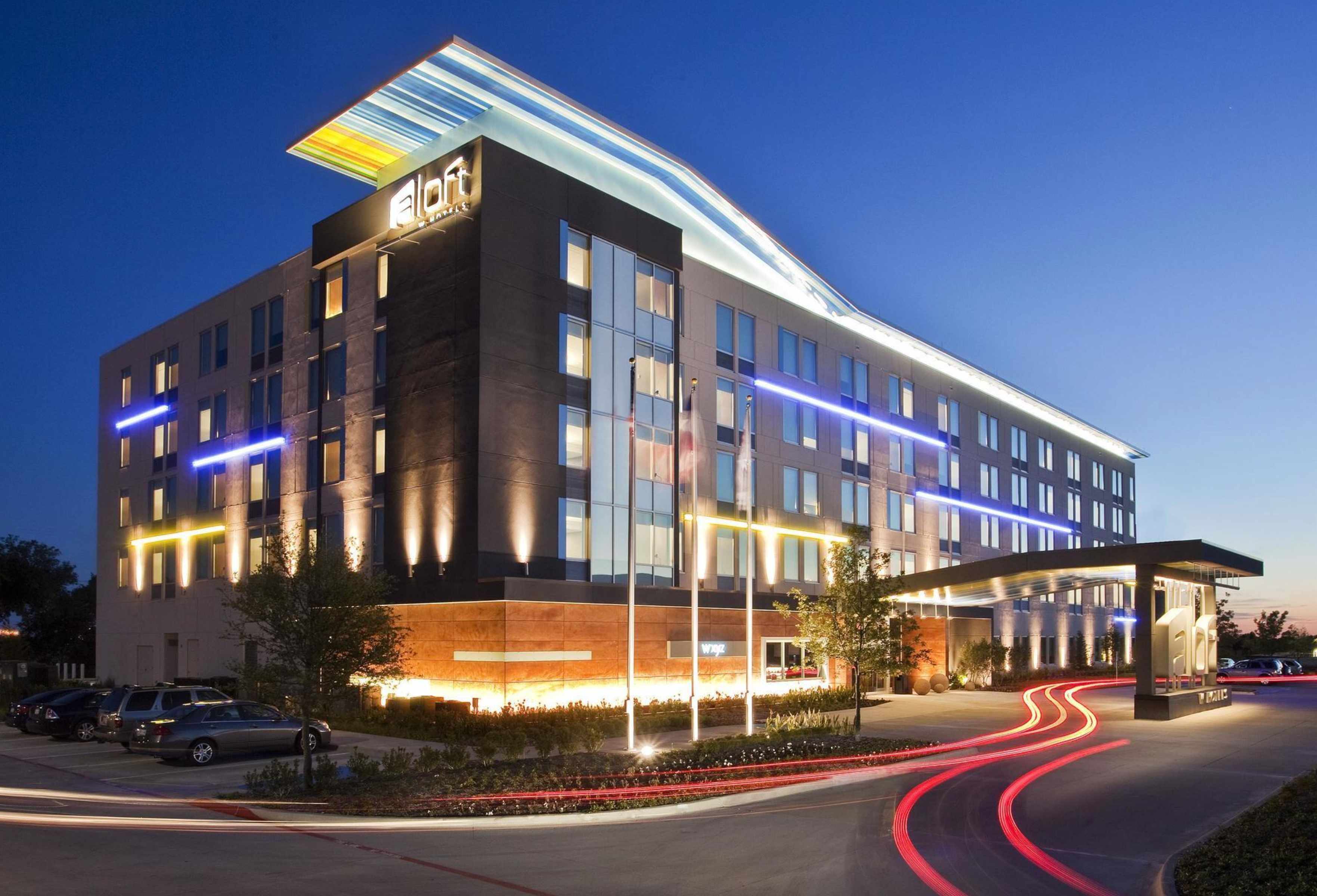 Modern Aloft hotel with contemporary architecture and evening lighting